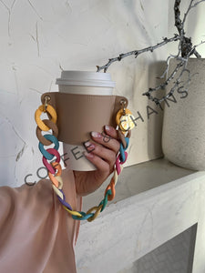 https://coffeeandchains.com/cdn/shop/products/sky-and-sand-limited-edition-coffee-sleeve-893_300x300.jpg?v=1647196749